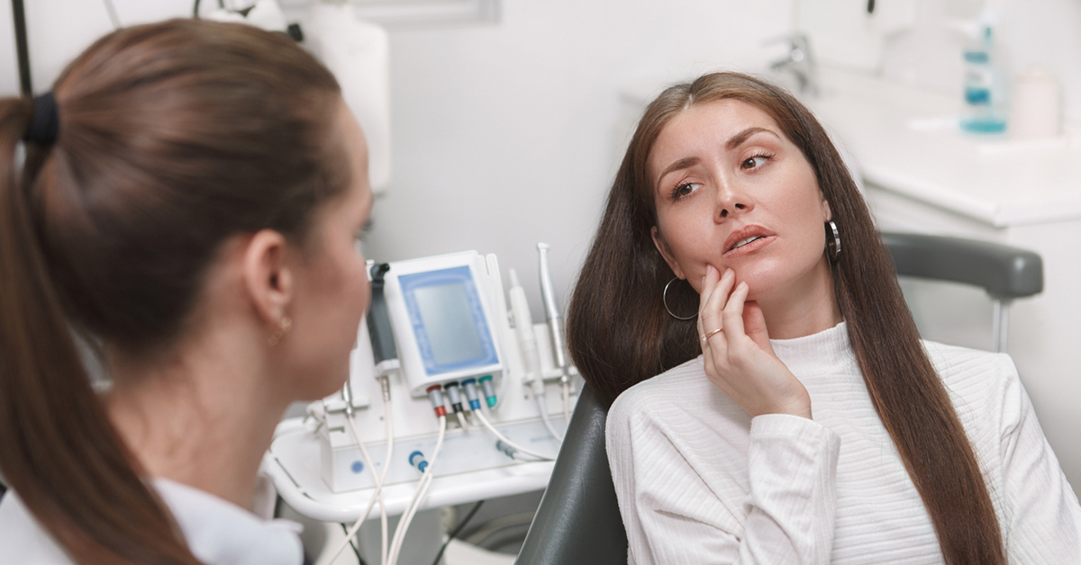woman with braces in pain