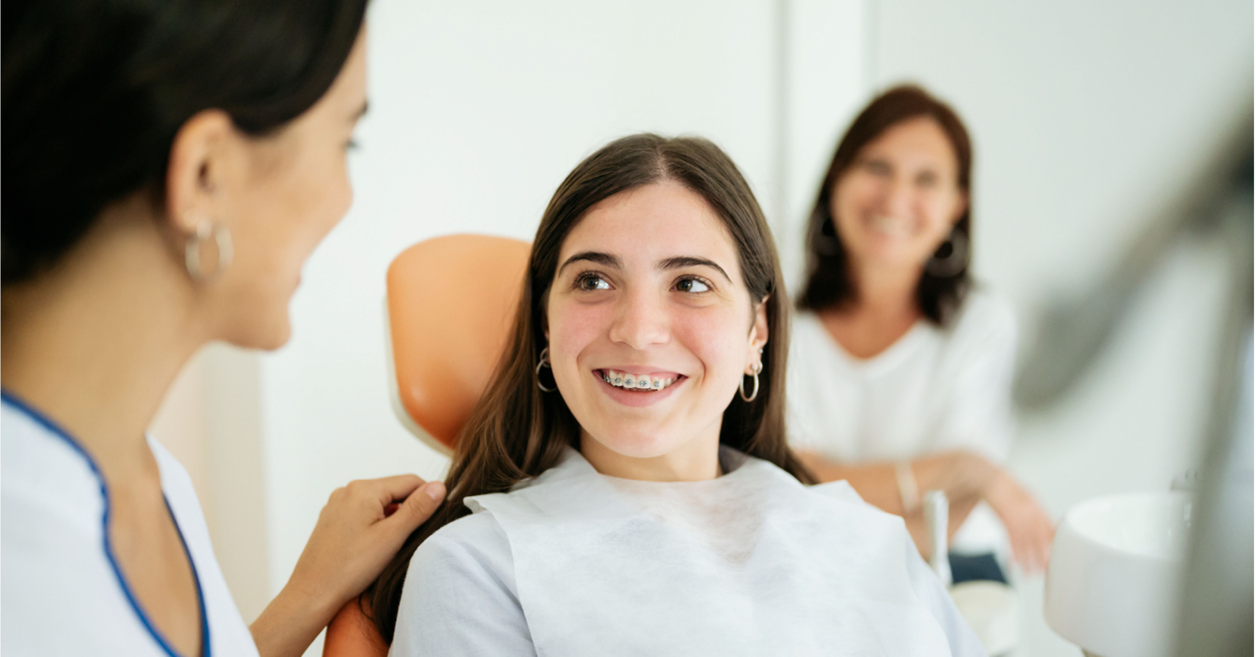 girl with braces at dentist